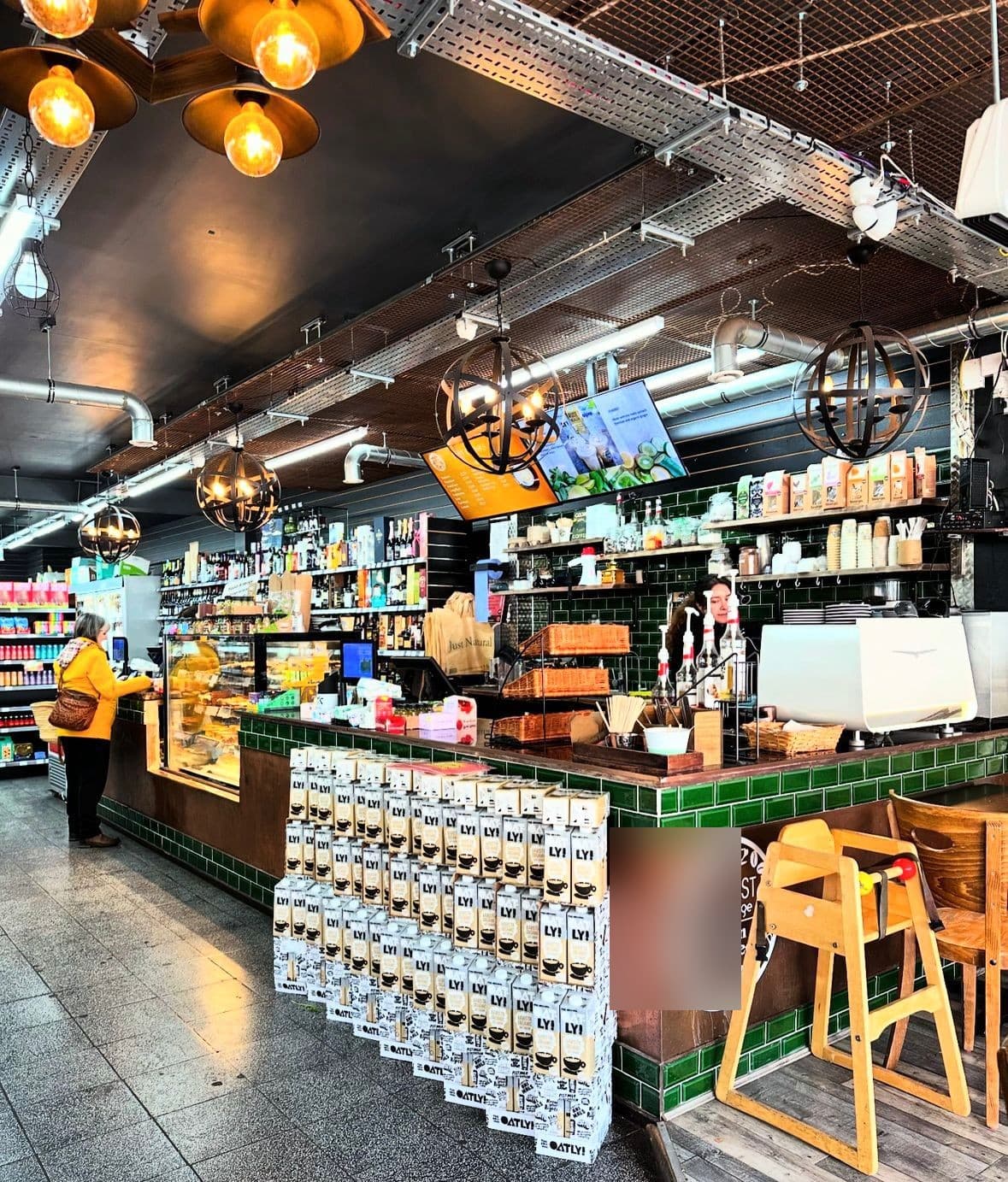 Warm Edison globes over the Threadle coffee counter.